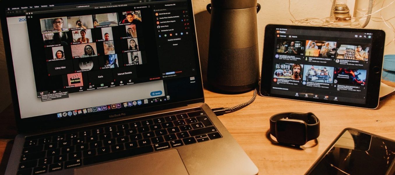 image of a desk with multiple electronic devices on top